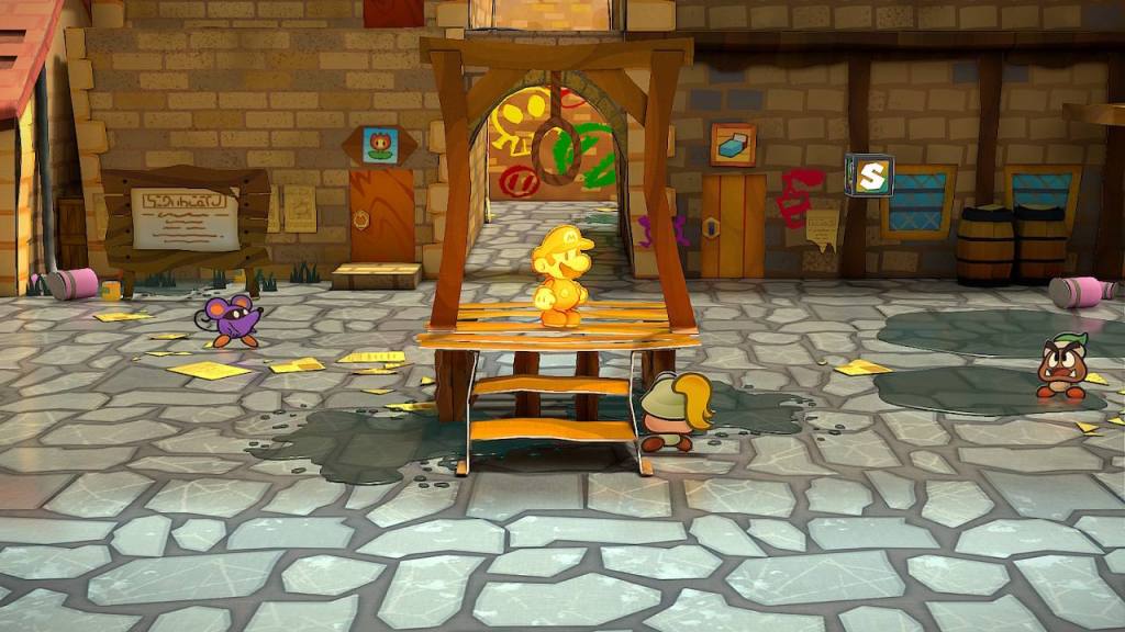 Mario stands on the gallows platform in central Rogueport. Everything is made of paper, including Mario. Mario has a gleaming golden sheen, indicating 100% completion of the game.